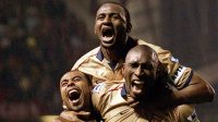 Arsenal players Ashley Cole, Patrick Vieira and Sol Campbell celebrate during the Premier League match between Manchester United and Arsenal played at Old Trafford, in Manchester, England on May 8, 2002. Arsenal won the match 1-0 to clinch the league title.