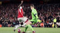 Bukayo Saka of Arsenal collides with Manuel Neuer of Bayern Munich towards the end of the UEFA Champions League quarter-final first leg match between Arsenal FC and FC Bayern Munchen at Emirates Stadium on April 9, 2024 in London, England