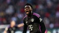 Alphonso Davies of Bayern Munich celebrates scoring his team's second goal during the Bundesliga match between FC Augsburg and FC Bayern München at WWK-Arena on January 27, 2024 in Augsburg, Germany. (Photo by Alexander Hassenstein/Getty Images)