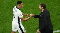 Trent Alexander-Arnold of Liverpool shakes hands with England manager Gareth Southgate, as he comes off after being substituted during the UEFA EURO 2024 group stage match between Serbia and England at Arena AufSchalke on June 16, 2024 in Gelsenkirchen, Germany.