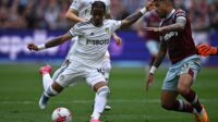 West Ham United's Italian defender Emerson Palmieri (R) blocks a shot by Leeds United's Dutch striker Crysencio Summerville during the English Premier League football match between West Ham United and Leeds United at the London Stadium, in London on May 21, 2023.